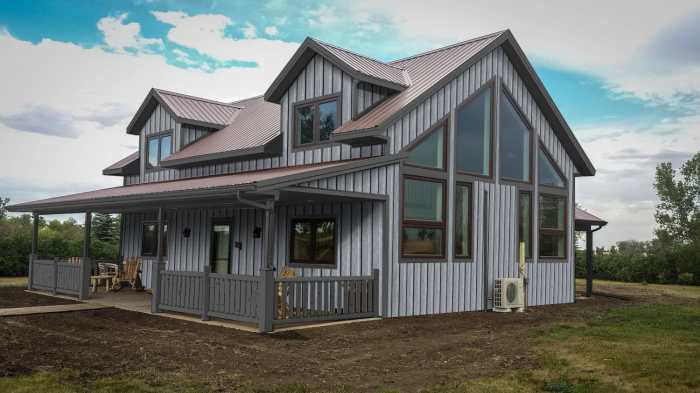 The boldness of the metal siding is softened by the muted color choice ... The boldness of the metal siding is softened by the muted color choice ...
